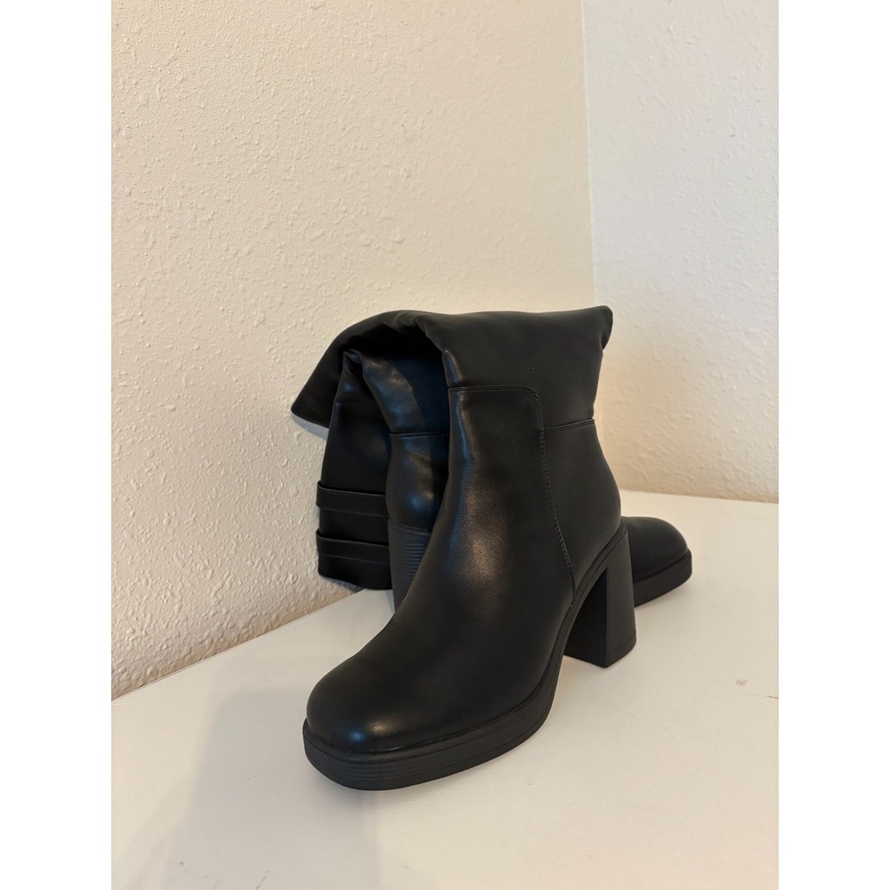 Tyndall High black boots with decorative buckels at the top